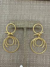 Load image into Gallery viewer, A gold earring
