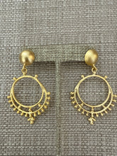 Load image into Gallery viewer, A gold earring
