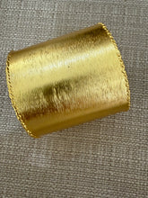 Load image into Gallery viewer, A gold cuff
