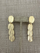 Load image into Gallery viewer, A gold earring
